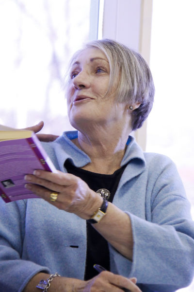 Sandra Dallas signs a book for a fan on March 1