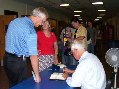 John Sandford signs for fans.
